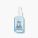 A clear glass dropper bottle of Kiehl’s Clearly Corrective Re-Texturizing Triple Acid Peel Serum with blue liquid, shown on a white background.