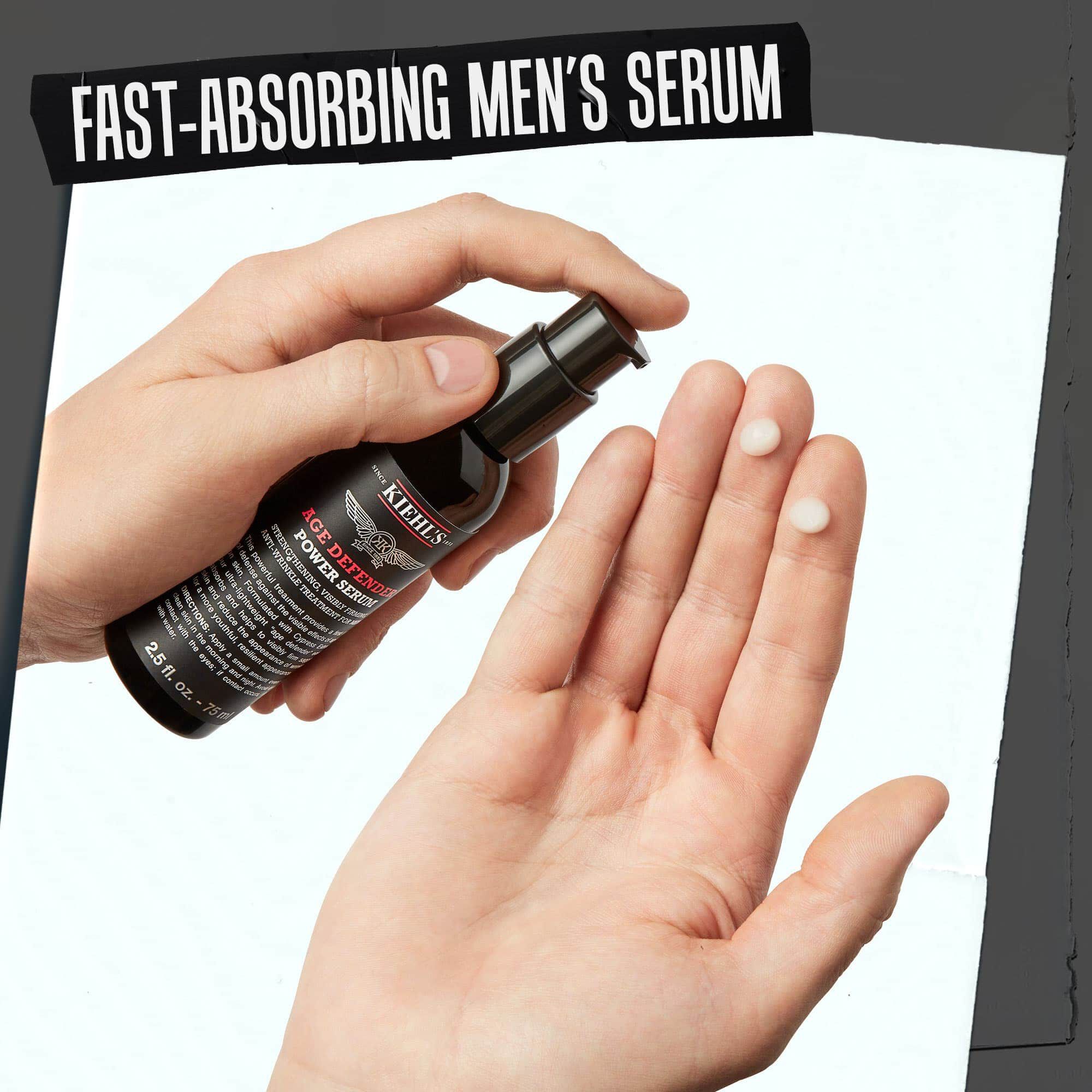 Hand dispensing Age Defender Power Serum; fast-absorbing men’s serum emphasizing its quick absorption.