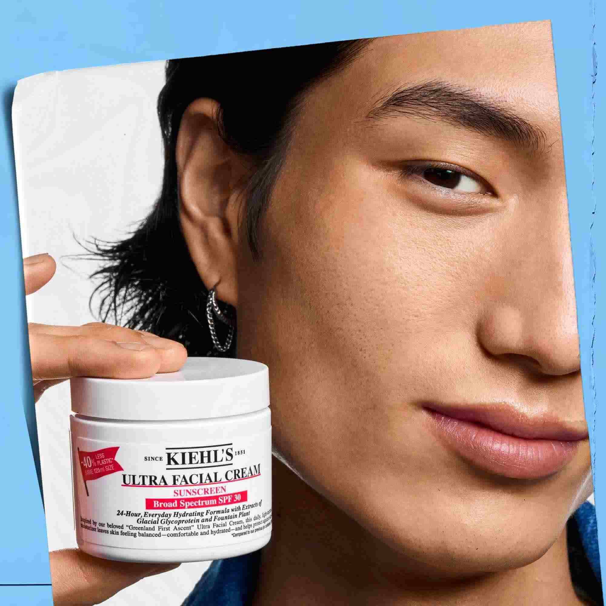 Ultra Facial Cream SPF 30 being held, showcasing its portability and ease of use.