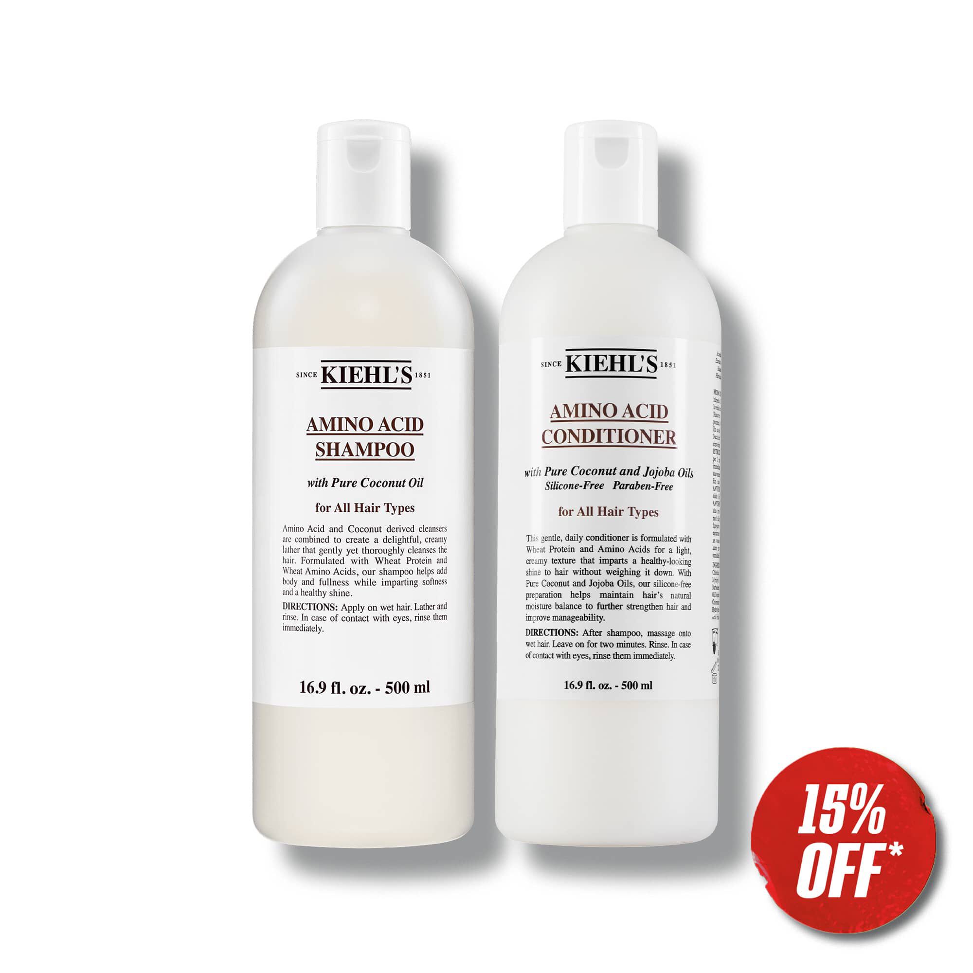 Two bottles of Kiehl's Amino Acid Shampoo and Conditioner are side by side, offering a 15% discount. Labels mention pure coconut oil for all hair types. Discount applies when products added to cart.
