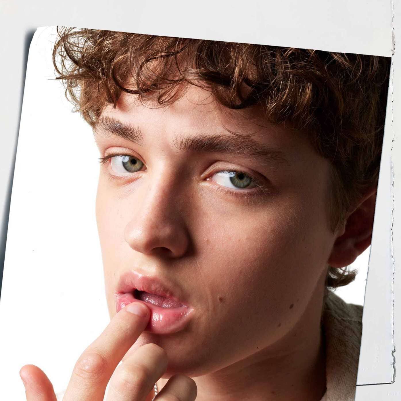 Lip Balm #1 being applied to lips, demonstrating its hydrating effect on skin.