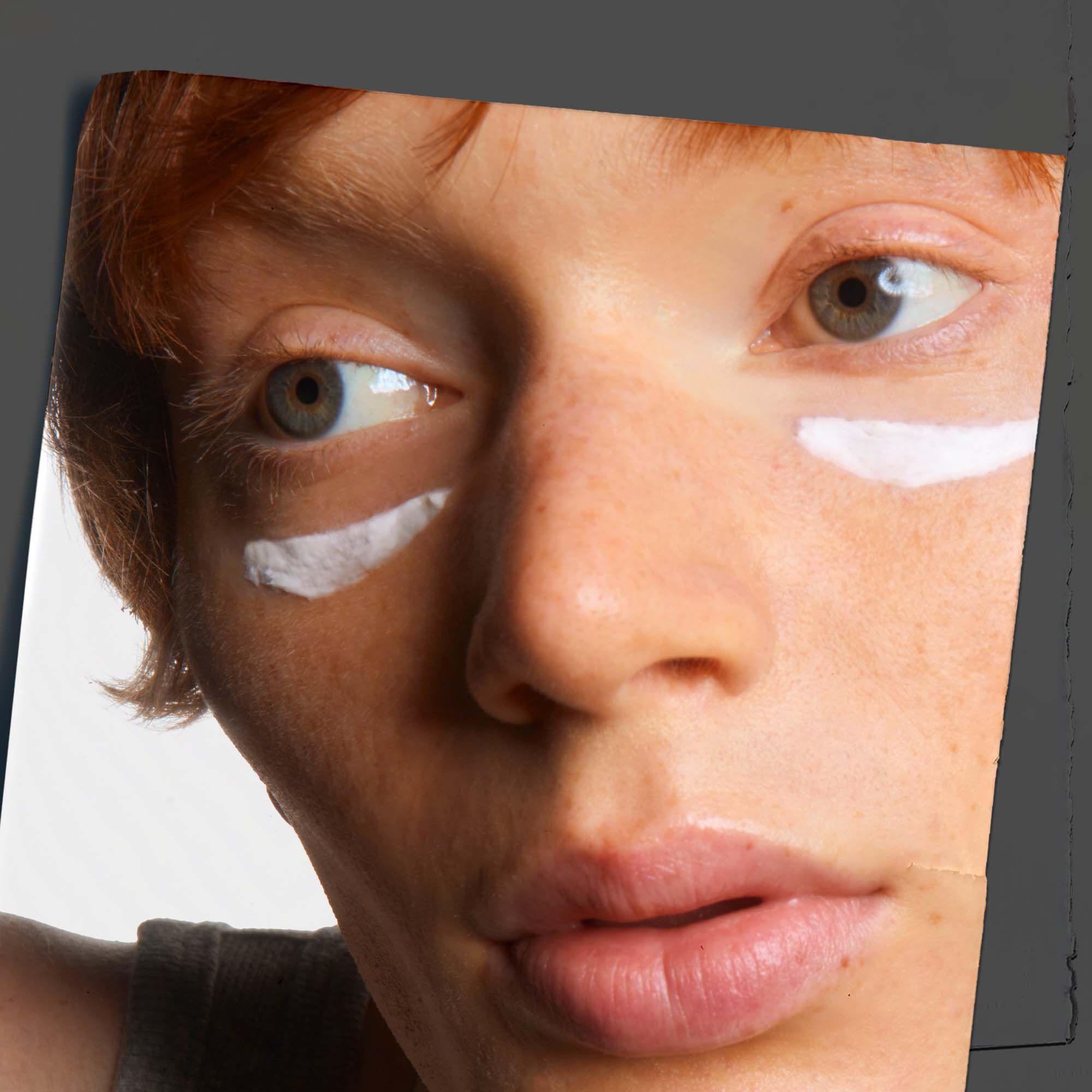 Close-up on skin showcasing the application of Kiehl's Age Defender Eye Repair.