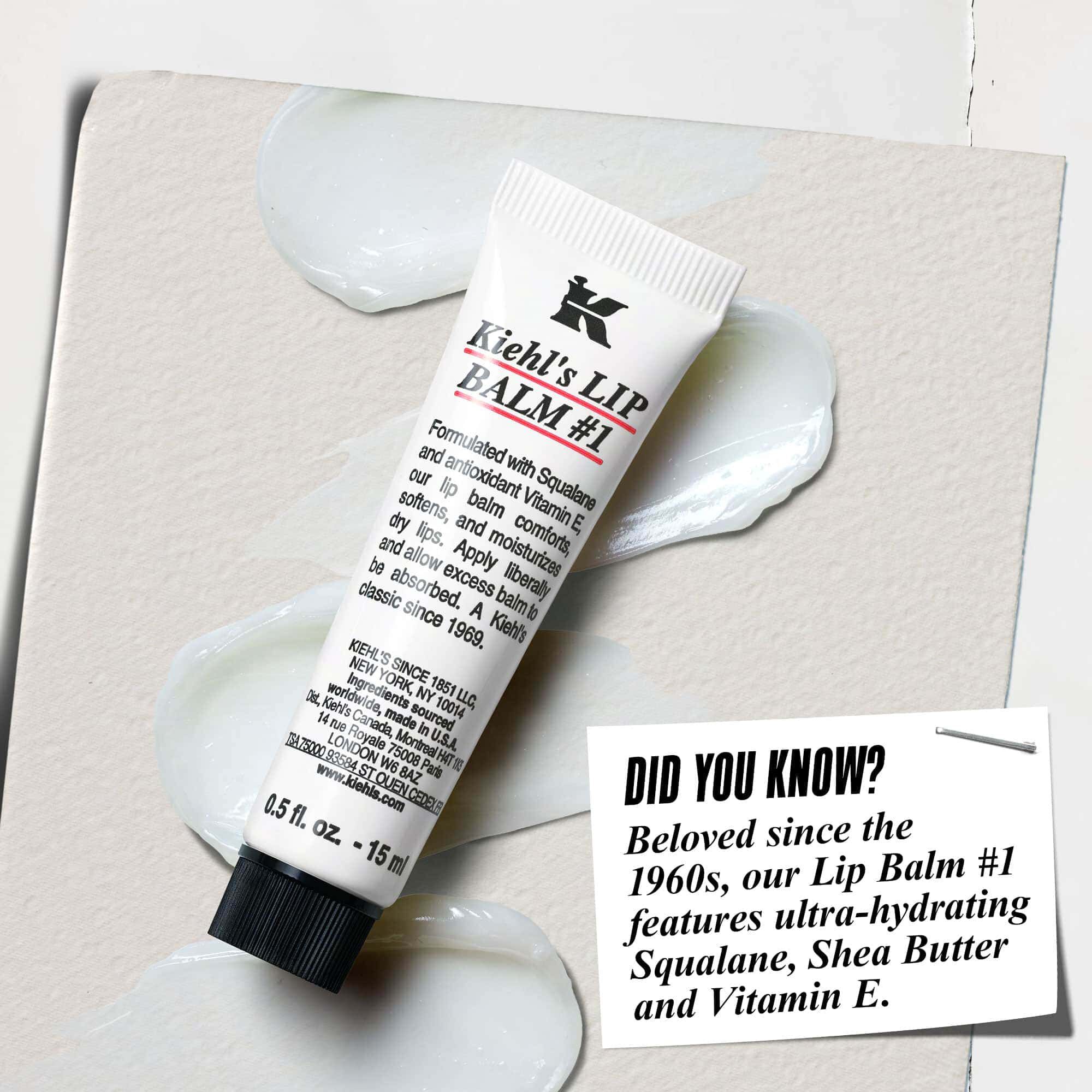 A tube of Lip Balm #1 on a white surface with text reading "Did You Know? Formulated with Squalane, Shea Butter, and Vitamin E for hydrated, smoother lips."