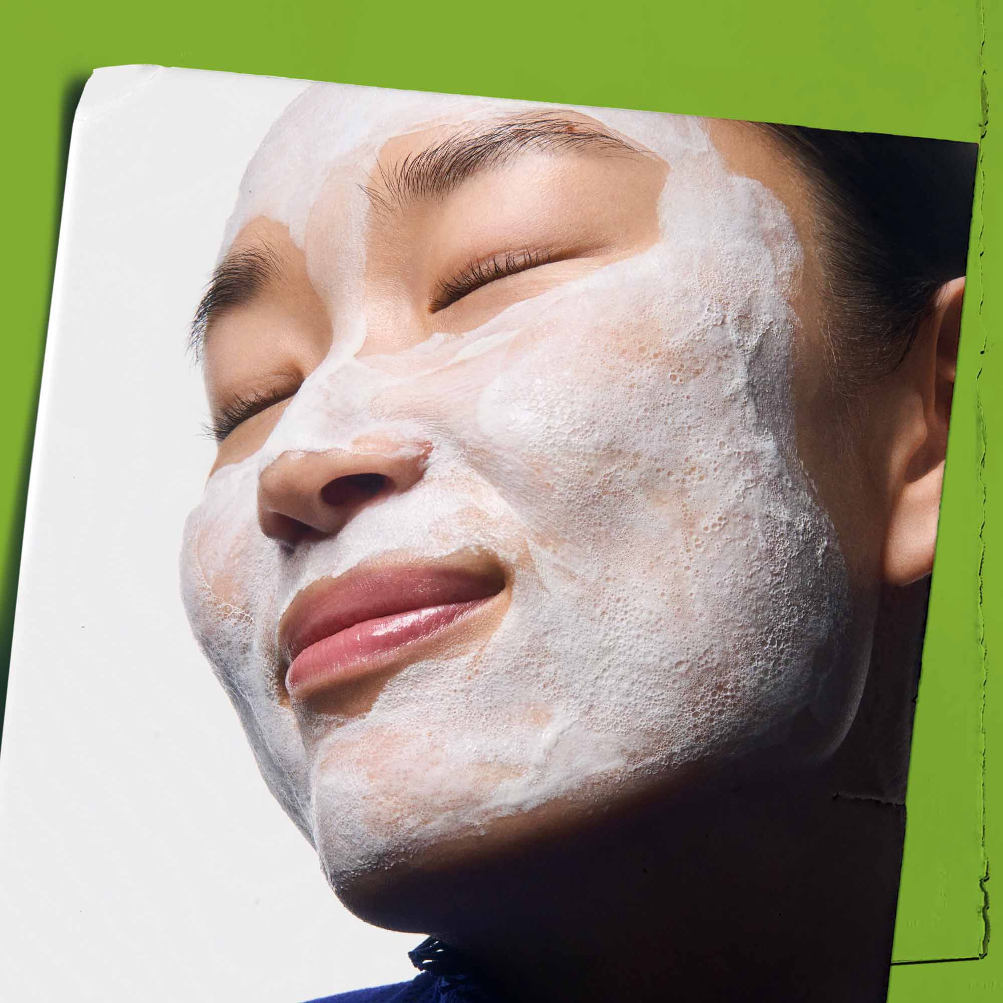 Rare Earth Deep Pore Daily Cleanser applied to the face.