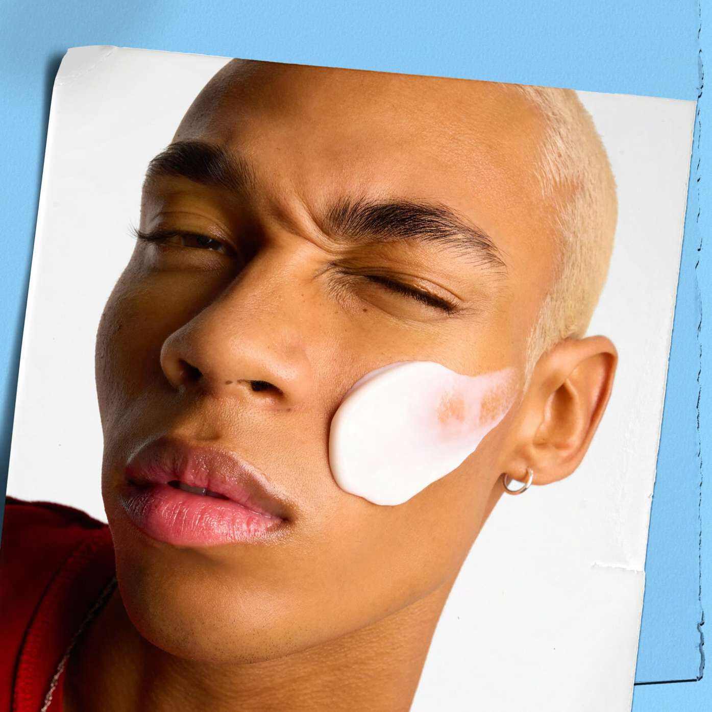 Model applying Kiehl's Ultra Facial Cream to their face