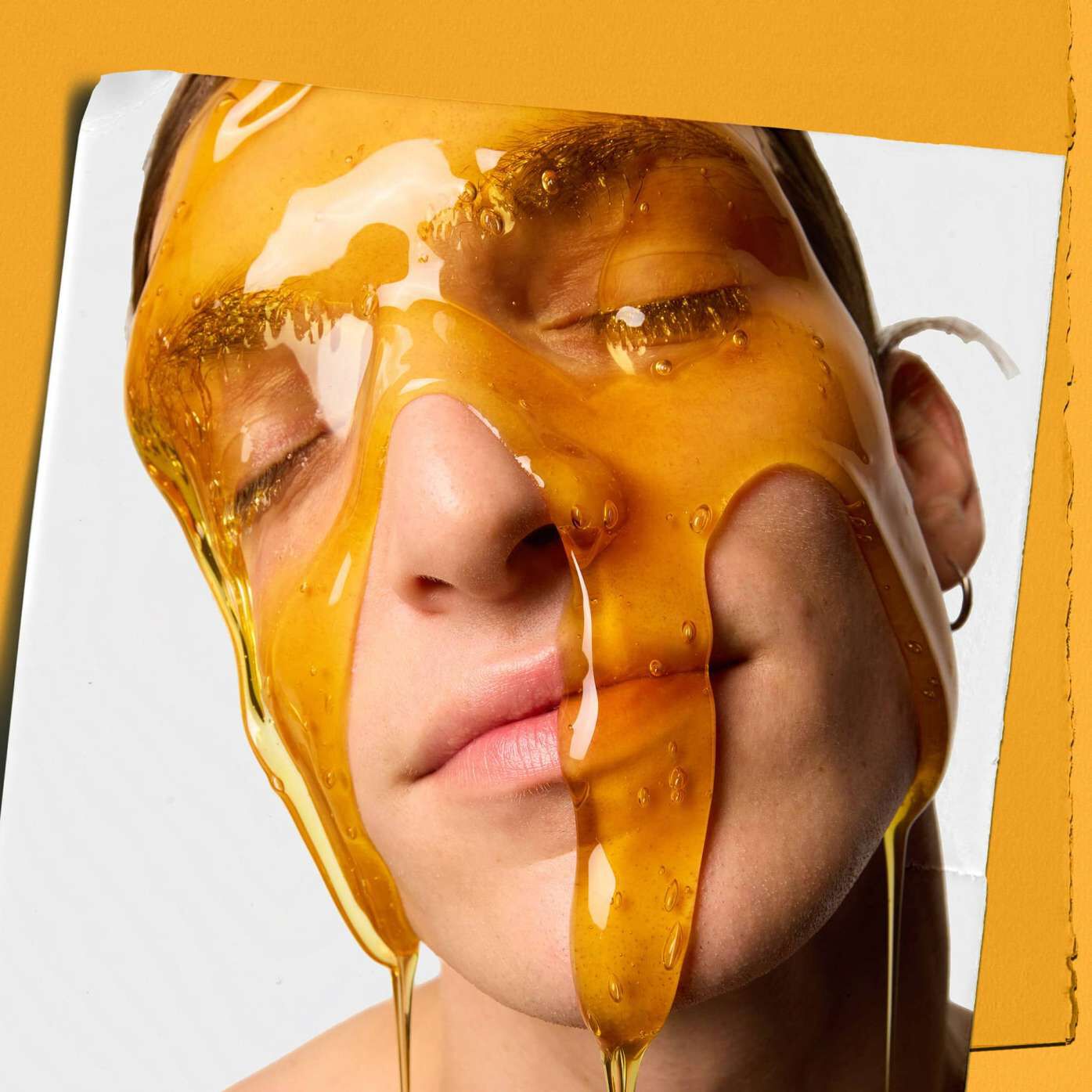 Model with Kiehl's Calendula Deep Cleaning Foaming Face Wash dripping down their face