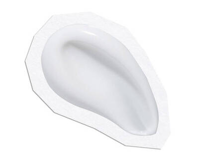 A smooth, white, curved gel or cream in a white applicator with an irregular shape.