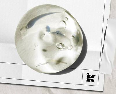 A wooden spoon holds several translucent, cube-shaped jelly candies on a white background.