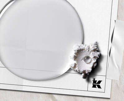 A dropper releasing a drop of liquid above three glass test tubes filled with different colored liquids.