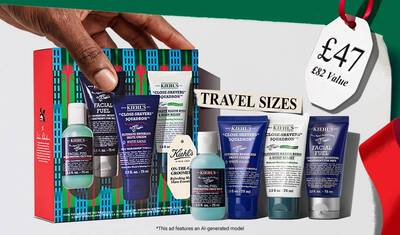 Kiehl’s holiday men’s travel-size gift set with face wash, shave cream, scrub, and moisturizer; promotional elements highlight “Travel Sizes” and a $66 value.