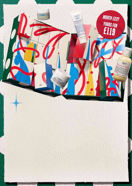 A festive mobile key visual for Kiehl's Holiday 2026 featuring an open advent calendar with colorful numbered drawers, holiday ribbons, and iconic skincare products including Ultra Facial Cream, Creme de Corps, and Ultimate Strength Hand Salve displayed against a festive green-and-white patterned background with blue sparkle accents.