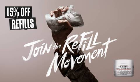 Promo banner reading "Join the Refill Movement" in white brush strokes next to "15% OFF REFILLS". Features a hand holding a Kiehl’s Ultra Facial Cream refill pouch and a standard product jar on a beige background.