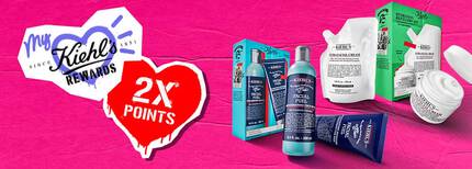 Promotional image featuring Kiehl's skincare products with a pink background, highlighting "My Kiehl's Rewards" and "2X Points."