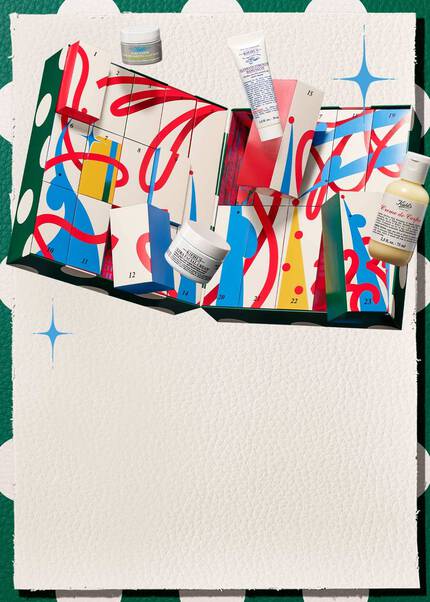 A festive mobile key visual for Kiehl's Holiday 2026 featuring an open advent calendar with colorful numbered drawers, holiday ribbons, and iconic skincare products including Ultra Facial Cream, Creme de Corps, and Ultimate Strength Hand Salve displayed against a festive green-and-white patterned background with blue sparkle accents.