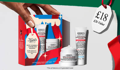 Hydrating Holiday Hits" skincare gift set on a green background, featuring Ultra Facial Cream and Creamy Eye Treatment with Avocado in festive packaging.​