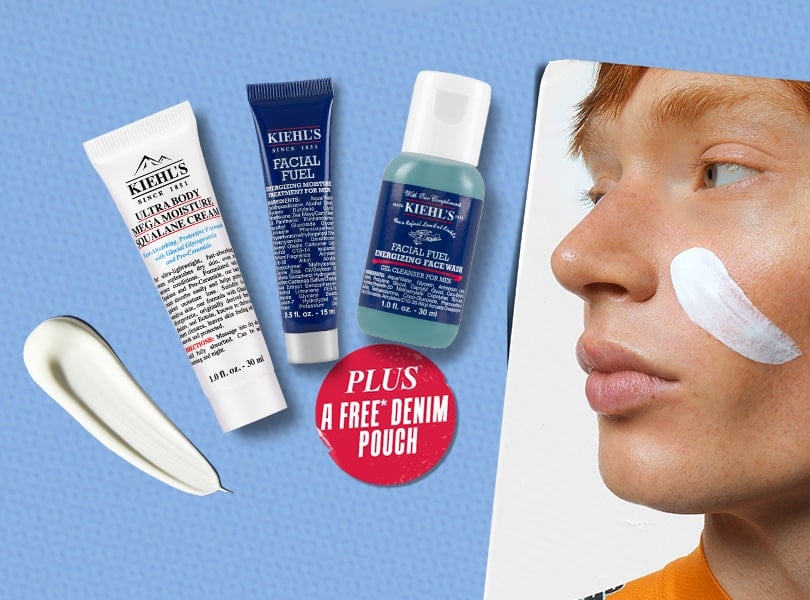 Three Kiehl's skincare products displayed on a blue background, including a cream and two cleansers, alongside a label for a free denim pouch.